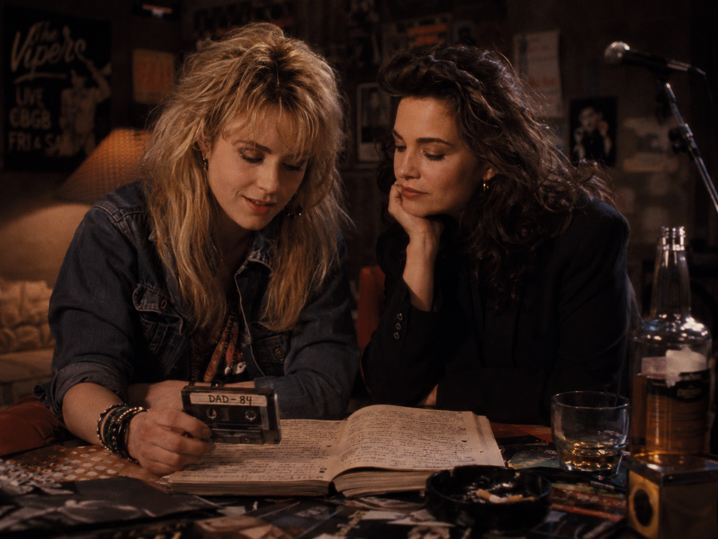Claire and Nora with their father's notebook and cassette